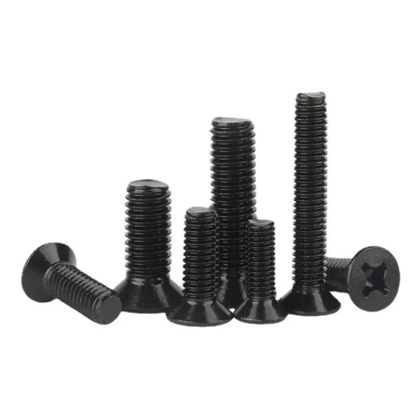 Six black stainless steel DIN 965 bolts, each with Phillips flat countersunk heads of varying lengths, stand on a white background.