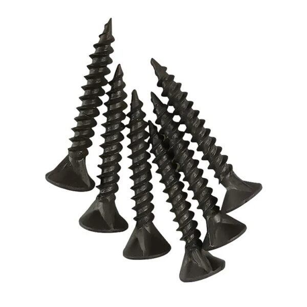 Seven Phillips black drywall screws, bugle head & coarse thread, scattered.