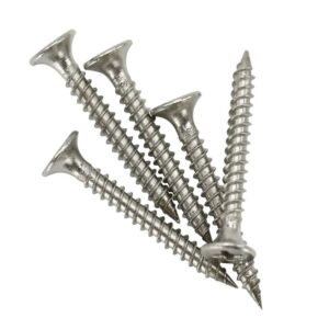 Five silver screws scattered on a white background, depicting organized chaos.