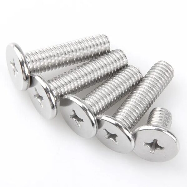 Five A2 stainless steel Phillips ultra-thin flat head screws are perfectly aligned on a white surface.