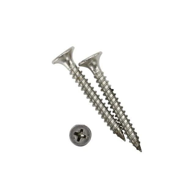 Two diagonal metal screws and a detached screw head lie precisely arranged on a white background.